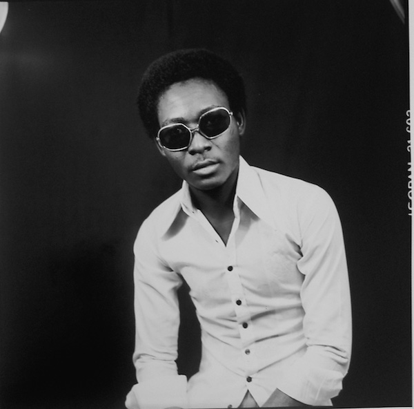 Malick Sidibé - Untitled (portrait of man in front of painted backdrop), 1983